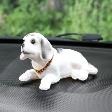 Dog on a car panel shocking his head, large, white color-2