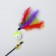 Domesticon with a plastic ball and feathers, a mix of flowers