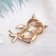 Brooch "Owl on a twig", black and white color in gold