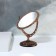The mirror is desktop, bilateral, with an increase, mirror surface 8.5 × 12.1 cm, bronze color