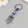 A keychain from the evil eye "owl on a branch" 3.3x7 cm
