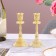 A set of 2 candlesticks, metal, 8 x 8 x 16.5 cm