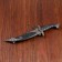 Curved souvenir knife, 26.5 cm, a long curl on the scabbard, black