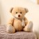 Soft toy "Bear", in a knitted scarf, mix color