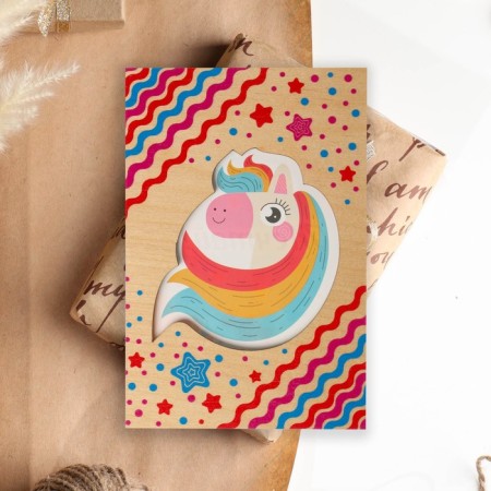A postcard with a wooden element "Dream!"