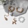 Earrings with the removable element "Transformer" dog, white color in gold