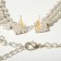 Set 2 objects: earrings, a necklace of “sparks” a web, white color in silver, 30 cm