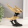 Polystone souvenir "Three dolphins on the wave, with patterns" gold 14x7x17.5 cm