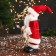 Santa Claus "with bells and with a flashlight on the staff" 30 cm, moves, red-white
