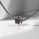Talisman "Crown", pink color in black silver