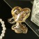 Brooch "Lady in a hat", black and white color in gold