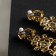 Clips "openwork" drops with curls, white-blue color in gold