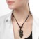 A pendant on the lace "Filin", the color is brown-black on a black lace, 80 cm