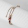 Bracelet with rhinestones "shine" on a puff, colored in gold