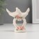 Polystone souvenir "Pigeons on an openwork stand with pink roses" 6x6.3x3 cm