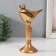 Polystone souvenir "Bird in the crown on the stand" Gold 14.3x8x20 cm