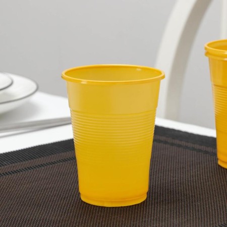 A glass of plastic disposable "pugs", 200 ml, yellow color