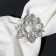 Clutch for a scarf “Bows with beads”, white color in silver