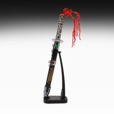 Souvenir dagger on a stand, on a sheath of a dragon, a handle in the shape of a light sword, 25 cm