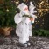 Santa Claus "in a high cap, in a strap and with a bag" 44 cm, silver-white