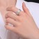 Ring Xuping Game of Light, white color in silver, size 17