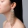 Hanging earrings with rhinestones "waterfall" rhombus, white color in gold, 17 cm