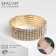 Bracelet with rhinestones "ice" 5 rows, white color in gold, d = 7.5 cm