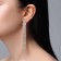Hanging earrings with Hollywood rhinestones different levels, white color in gold, 11 cm