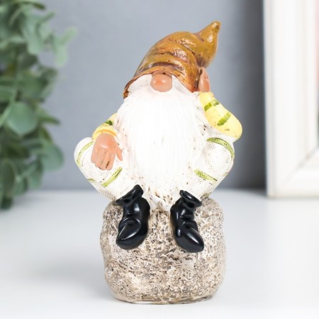Polystone souvenir "Dwarf in an orange cap on a stone" 11x6.2x5.7 cm