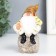 Polystone souvenir "Dwarf in an orange cap on a stone" 11x6.2x5.7 cm