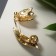 Brooch "Snowstep flower" with bead, white-green color in gold