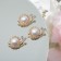 Brooch "Snail" with a pearl, white color in gold (indivisible packing 12 pcs., Price per pcs.)