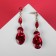 Hanging earrings with “Party” rhinestones path of drops, red color in gold, 7 cm