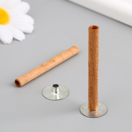 A candle wick with a metal holder is a round 0.6x6.5 cm