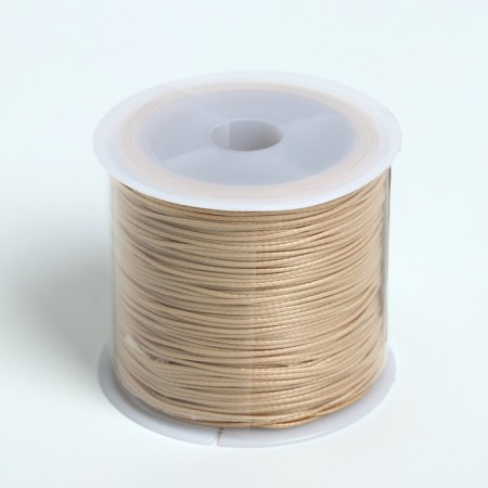 The cord waxed from polyester d = 0.5mm, l = 50m, beige color