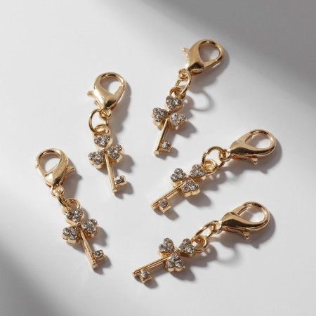 Charm "Key", white color in gold-1