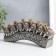 Polystone souvenir "Seven elephants on a tusk with flowers" silver 21x4x9.8 cm