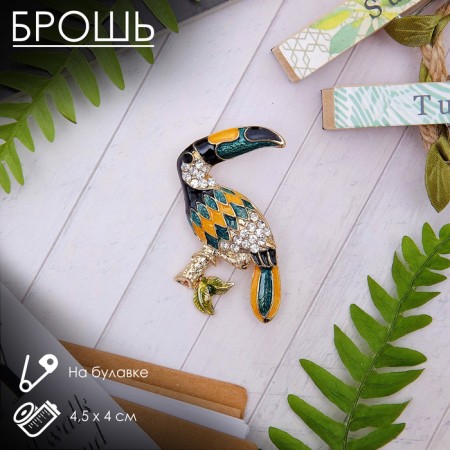 Brooch "Tukan" tropical, colored in gold