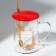 Glass mug with a spoon and a lid of the "Magic New Year", 470 ml