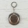 A keychain opener for keys "Distract from the hustle and bustle", diam. 5.8 cm