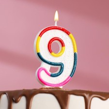 A candle for a cake with sparkles 