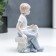 Souvenir Ceramics "Boy on a bench with a dog" 14 cm