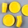 A set of paper utensils: 6 plates, 6 glasses, yellow color