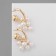 Earrings with pearls "bun" on the ring, the color is white in gold