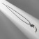 Unisex pendant "Tiger Fang", white color in black silver on a black lace, 40 cm