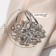 Ring for the scarf "flower" voluminous with rhinestones, white color in silver