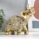 Souvenir Polystone "Golden Elephant with a Popone of Beads with bells" MIX 15x14.5x7.7 cm