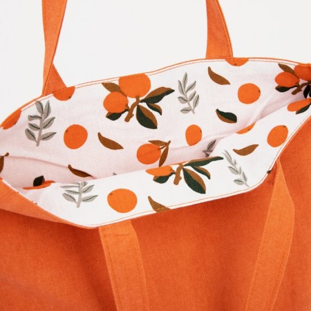 The shoper bag is bilateral, without fastening, external pocket, orange color-3