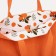 The shoper bag is bilateral, without fastening, external pocket, orange color