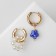 Earrings with the removable element "Transformer" flower, white-blue color in gold